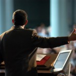 Preacher at high tech pulpit