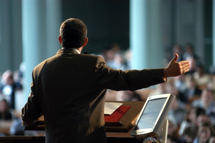 Preacher at high tech pulpit