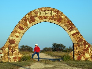 Under the stone archway entrance to Renderbrook Spade Ranch, south of Colorado City, Texas